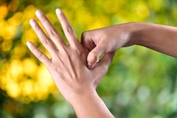 acupressure, self medication concept in outdoor sunlight