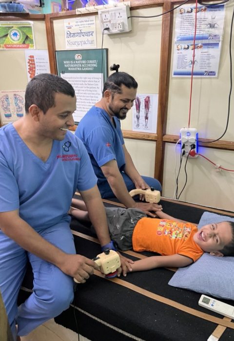 Dr. Abhimanyu and Dr. Shamshuddin treating a child